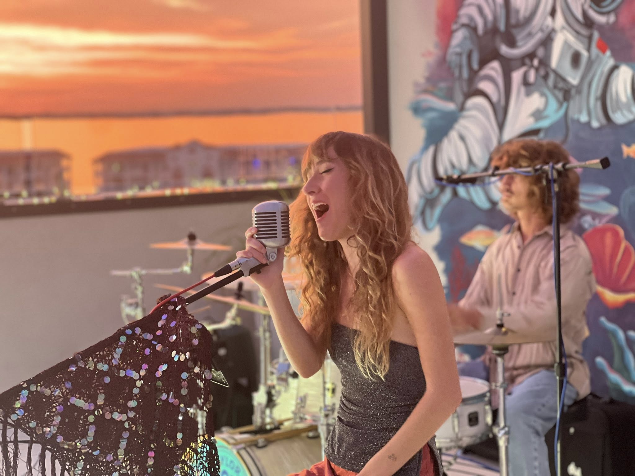 Saylor singing at sunset