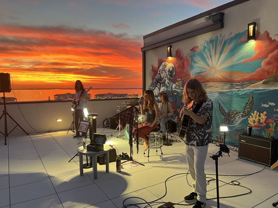 The band at sunset rooftop show
